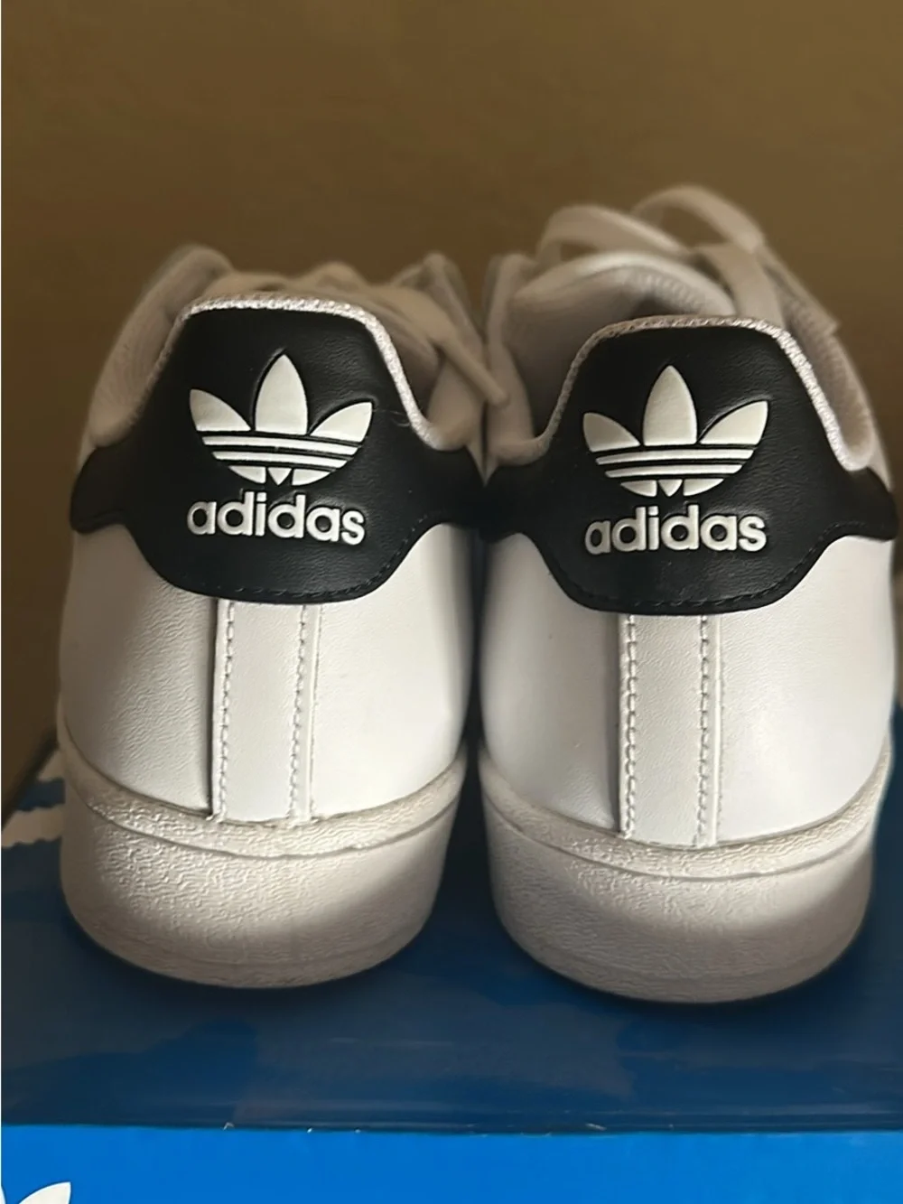 adidas Superstar white and black sneakers